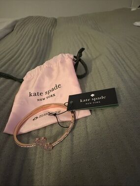 kate spade rose gold-tone crystal bow bangle with pink pouch